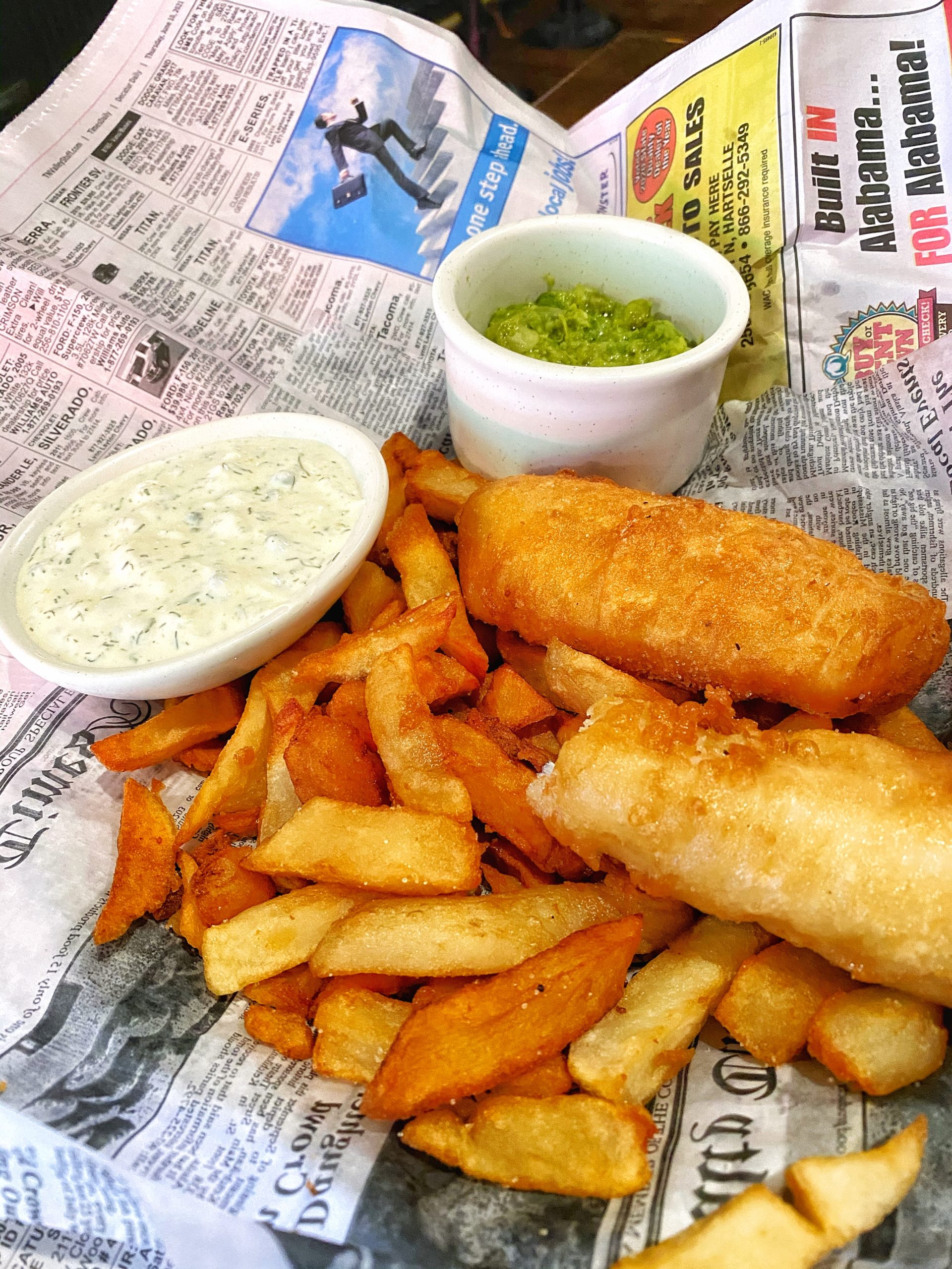 The Poppy and Parliament signature dishes Traditional Fresh English Fish and Chips, Shane's Old English Bangers and Mash, The Prime Minister (40-oz. Tomahawk Steak)